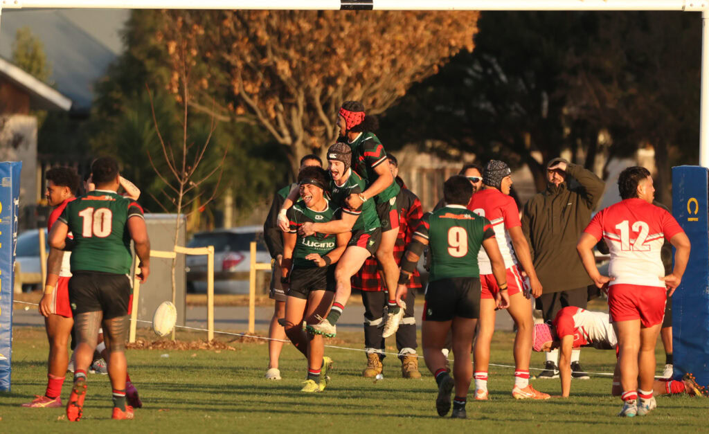 Lennox Tuiloma celebrates his try with Tom Ruwhiu and Matthew Logopati